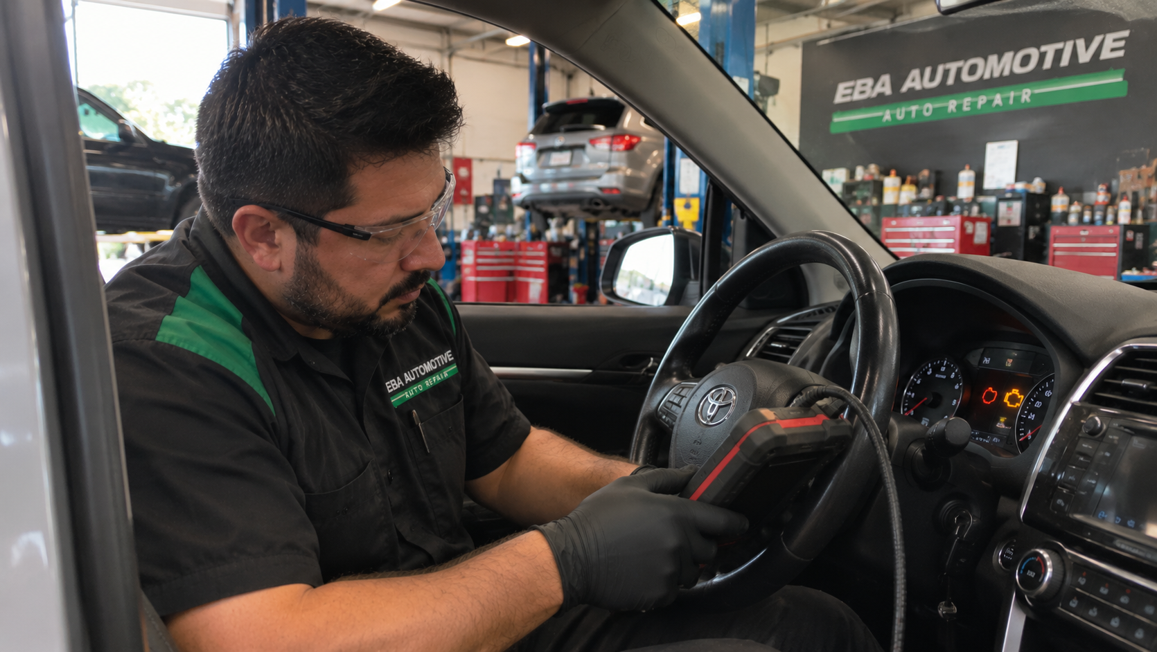 EBA Automotive technician diagnosing a check engine light inside a vehicle at an auto repair shop in Allen, Texas.